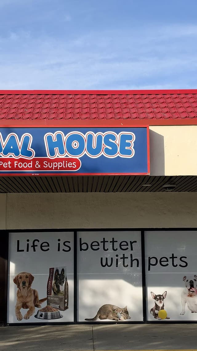 The Animal House storefront at Northills under a blue sky, its windows reading Life is better with pets